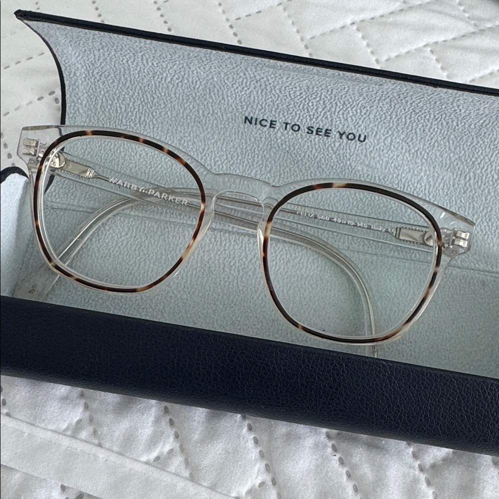 Warby Parker clear frames with tortoise shell rims glasses